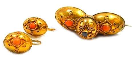 A Victorian brooch and earring set, modelled as two oval sections set with coral and peridot, and a pair of associated earrings, in a bloomed finish, unmarked, 6.8g all in.