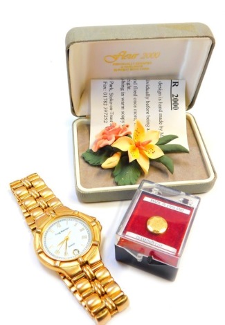 A Flower 2000 ceramic flower brooch, a Krug-Baumen Baron gentleman's wristwatch with quartz movement, and a diamond cut collar stud. (3)