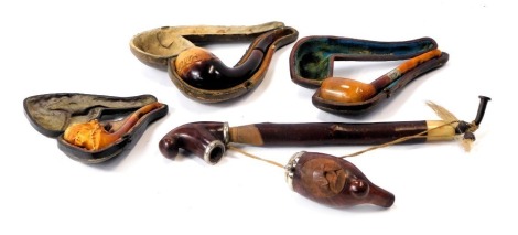 A group of pipes and pipe parts, comprising a Louvenir wooden pipe, in fitted case with amber mouthpiece, a silver collared WITC pipe, a carved meerschaum type pipe with cheroot cap, and a wooden Tyrolean pipe, three boxed. (4, AF)