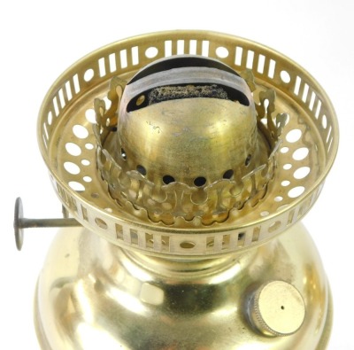 Two brass oil lamps, each with a white shade and funnel on circular foot, 51cm high. (2) - 2