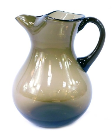 A 20thC smoky glass water jug, 21cm high.