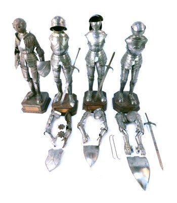 Four metal replicas of coats of armour, on oak bases with title plates, comprising Renaissance model early 16thC, Maximilian model middle 16thC, Vic model middle 16thC and Crusader model 12thC, 45cm high. (AF)