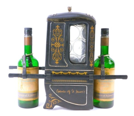 A novelty wine bottle stand, formed as a coach with two wine bottle sections, hold The Grants of St James sherry bottles, 35cm high, 39cm wide.