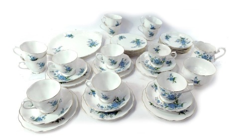 A Royal Albert porcelain Forget-Me-Not tea service, comprising twelve cups and saucers, twelve side plates, cake plate, milk jug and sugar bowl.