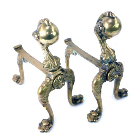 A pair of late 19thC fire dogs, formed with ball and claw top, on claw tripod feet, 25cm high, 15cm deep.