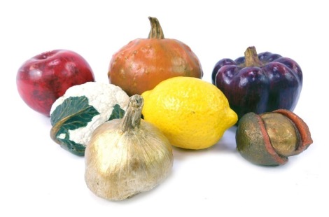 A group of plaster painted fruit and vegetables, comprising pumpkin, pepper, apple, lemon, garlic, cauliflower and chestnut. (7)