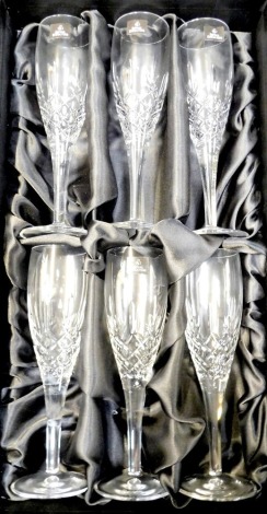 A set of six Royal Doulton crystal Champagne flutes, cased.