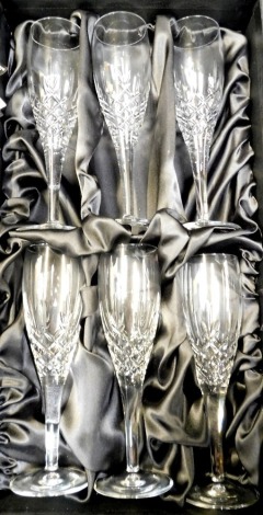 A cased set of six Royal Doulton crystal Champagne flutes, boxed.