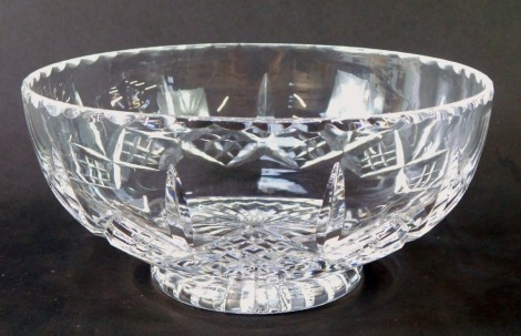 A Waterford Crystal fruit bowl, with a petalated border, and cross hatched body, on star base, inscribed Waterford, in Waterford Crystal box, 18cm diameter.