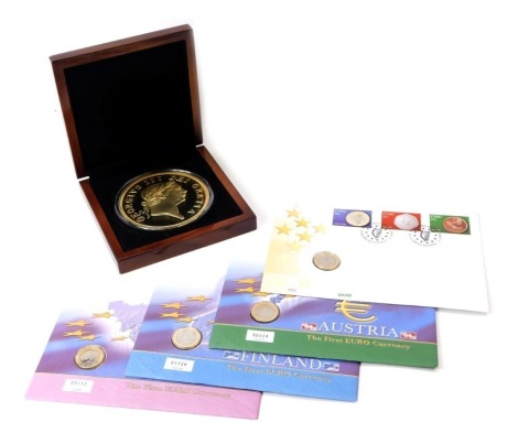 Collector's coins, to include a London Office Mint First Ever Military Guinea Golden Commemorative, layered in 24ct gold, boxed with presentation certificate, Belgium, Finland, Austria and Irish One Euro coins in presentation pack.