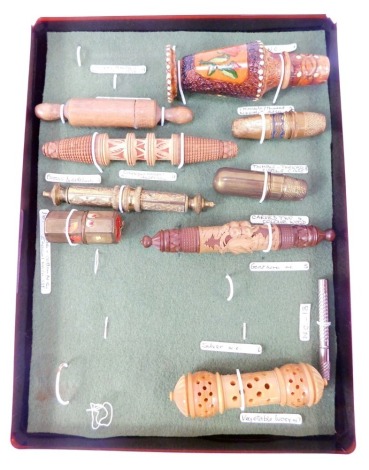 A group of needle cases, to include a wooden example modelled as a rolling pin, carved wooden Austrian case, vegetable ivory case, etc.