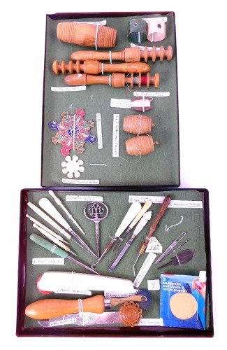 A group of sewing implements, to include cotton thread winders, a cotton reel holder modelled as a barrel, another similar, a turned wooden bodkin case, Continental white metal stiletto, ribbon hooks, thread waxer, stretch markers, ribbon threaders, etc.