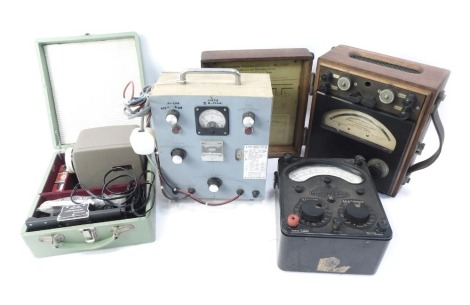 Various slide projectors, to include a Mini 44 slide projector kit, a Deac charger unit, Universal Avometer, etc. WARNING! This lot contains untested or unsafe electrical items. It is supplied for scrap or re-conditioning only. TRADE ONLY