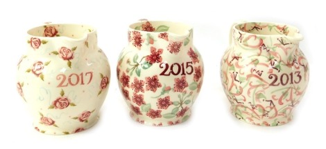 Three Emma Bridgewater pottery year jugs, for 2013, 2017 and 2015, 14cm high.