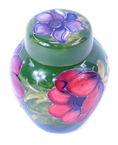 A Moorcroft pottery Anemone pattern ginger jar and cover, green ground, impressed marks, 11cm high.