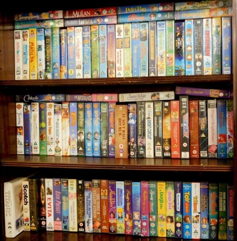 Various Disney and other VHS tapes, to include Lady and the Tramp, The Aristocats, Snow White and the Seven Dwarfs, Mulan, Peter Pan, Hercules, Aladdin, together with Harry Potter, Lord of the Rings, Toy Story, other Pixar, etc. (3 shelves)