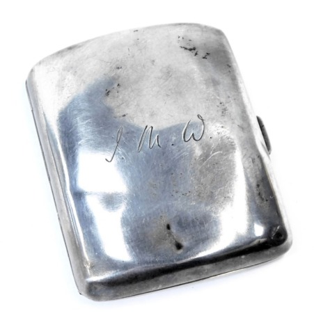 An Edward VII silver cigarette case, of curved form bearing the initials JMW, Birmingham 1913, 2.53oz.