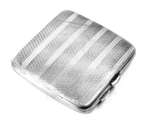 A George V silver cigarette case, with engine turned striped design, and piecrust crest bearing the initial BR, Birmingham 1923, 3.49oz.