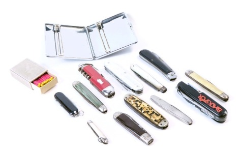 A stainless steel Sylvia chrome cased cigarette case, group of penknives, including one with carved horn deer, mother of pearl handled US Army, Swiss, Victorinox and others. (a quantity)