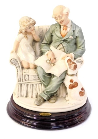 A Florence by Giuseppe Armani figure group, modelled as Granddad with little girl, on hardwood base, 19cm high.