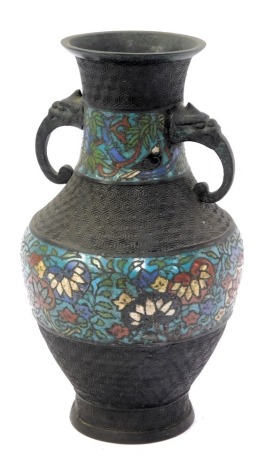 A late 19thC Chinese Champleve enamel vase, of baluster form, with incised hexagonal decoration and two bands of inlaid enamelled decoration, 28cm high. (AF)