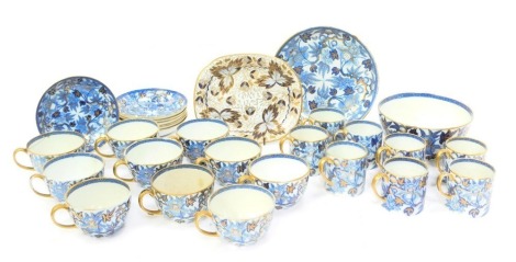 A 19thC Wedgwood porcelain part tea and coffee service, decorated with blue flowers against a white ground, gilt heightened, to include coffee cups, teacups and saucers, bowl, etc., some with impressed marks to underside.