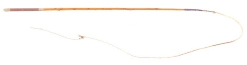 A Crawley & Son London, coaching whip believed to be holly with brown leather handle, with rope end, stamped, 230cm long overall.