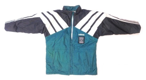 An Adidas Liverpool Football Club waterproof jacket, in green, black and white colour way, with fabric badge.