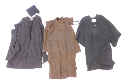 A Ben Nevis brown full length waxed jacket, size medium, together with a Ravenscroft & Willis graduation gown, mortar board, and a further academic gown.