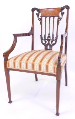 A late 19thC open armchair in the Sheraton style, with an inlaid pierced scroll carved back, boxwood line inlaid arms, Regency stripe overstuffed seat raised on square tapering legs and out splayed feet, together with an Edwardian mahogany stool, with cur - 2