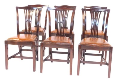 A set of six Edwardian mahogany dining chairs, each with a pierced vase shaped splat, brown leather overstuffed seat, on square tapering moulded legs united by a H shaped stretcher.