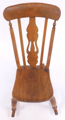 A late 19thC elm and beech lath back rocking chair, solid rail and pierced splats, solid seat, on turned legs united by H stretcher, possibly later adapted to a rocker. - 2