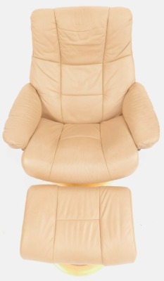 A Stressless reclining armchair, in taupe leather upholstery, on a beech circular base, together with a matching footstool. - 2