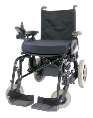 A Sunrise Medical Powertec F40 mobility chair, model number F40VR, with instruction manual and charging cable.