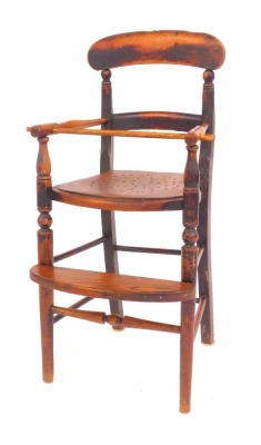 A 19thC elm child's highchair, with solid rail and turned supports, pierced later seat, on turned legs united by stretchers with foot rest, 86cm high.