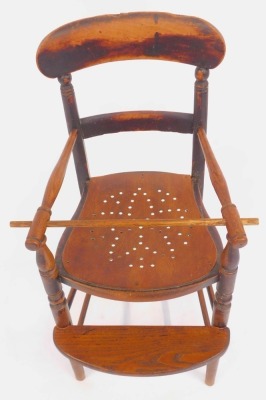 A 19thC elm child's highchair, with solid rail and turned supports, pierced later seat, on turned legs united by stretchers with foot rest, 86cm high. - 2