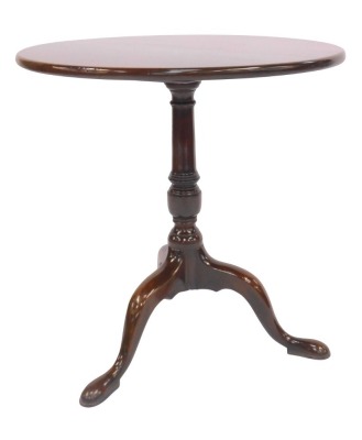 A 19thC tilt top table, the circular top on a turned column raised on cabriole legs on pad feet, 69cm high, the top 68.5cm diameter.