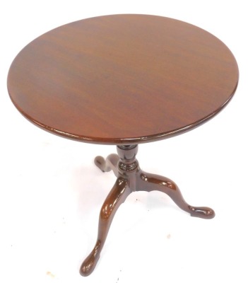 A 19thC tilt top table, the circular top on a turned column raised on cabriole legs on pad feet, 69cm high, the top 68.5cm diameter. - 2