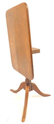 A 19thC oak tilt top table, the rectangular top with a rounded edge, on turned column terminating in three outswept legs, 73cm high, the top 52cm x 70cm. - 4