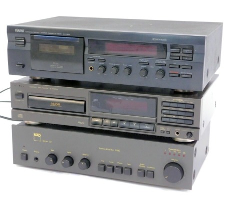 A Yamaha stereo cassette deck, KX-393, together with a Nad series 20 stereo amplifier 3020, and a Technics compact disc player, SL-PG200A.