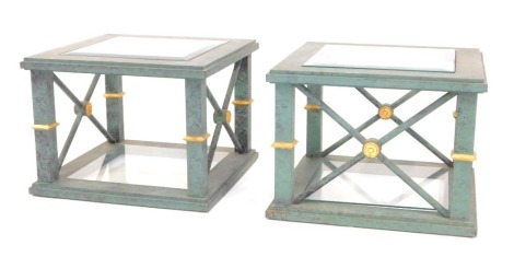 A pair of 20thC lamp tables, each with a square top with bevelled glass inset panel, raised on X framed stretchers, with under tier, in green mottled paint work, with gilt highlights, 46cm high, the top 61cm x 60cm.