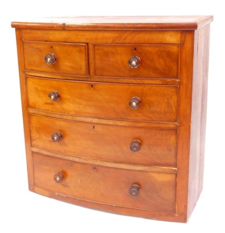 A Victorian mahogany bow front chest, of two short and three long drawers, lacking feet, 106cm high, 103cm wide, 50cm deep. (AF)