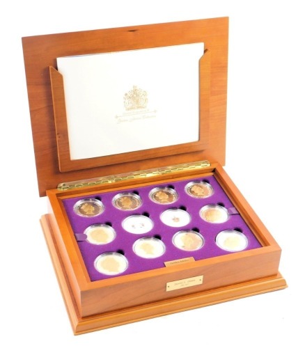 A Queen Elizabeth II Golden Jubilee Royal Mint coin collection, comprising twenty four silver five pound coins, each enamelled or gilded and decorated with various scenes commemorating Elizabeth II's golden jubilee, with registration certificate for Royal