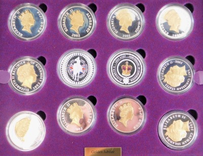 A Queen Elizabeth II Golden Jubilee Royal Mint coin collection, comprising twenty four silver five pound coins, each enamelled or gilded and decorated with various scenes commemorating Elizabeth II's golden jubilee, with registration certificate for Royal - 2