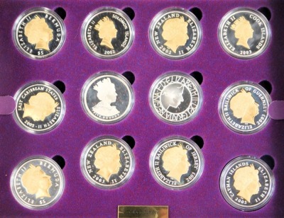 A Queen Elizabeth II Golden Jubilee Royal Mint coin collection, comprising twenty four silver five pound coins, each enamelled or gilded and decorated with various scenes commemorating Elizabeth II's golden jubilee, with registration certificate for Royal - 3