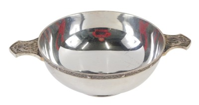 A Queen Elizabeth II silver quaich, the bowl with two serpent moulded handles, of plain design, maker W&W, London 1985, 11.06oz, 15cm diameter.