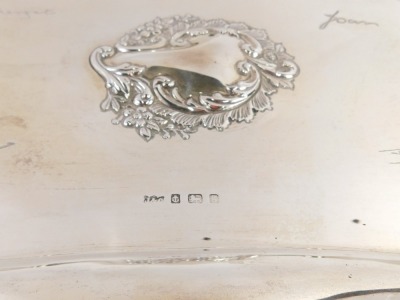 A Edward VII silver embossed serving tray, rectangular form with a fluted border, central vacant cartouche with fern and flower spray, bearing signatures Margaret, Jack, John and Joan, 30cm x 22cm, Birmingham 1906, 15.72oz. - 4