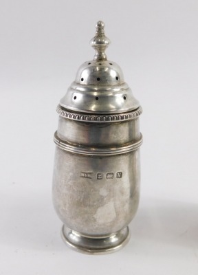 A pair of George V Walker and Hall silver pepperettes, each with a pierced top, Birmingham 1920, 2.82oz. (2) - 2