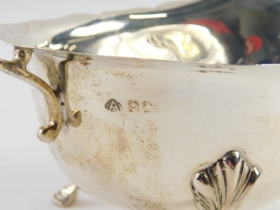 A 20thC silver sauce boat, with a fluted and moulded border, with a shaped handle, Birmingham, with rubbed hallmarked believed to be 1936, 2.88oz. - 2