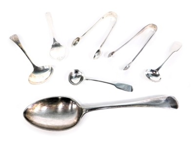 A group of silver and other cutlery, comprising a pair of Victorian silver toddy ladles bearing the initials M.W.B, a pair of Victorian engine engraved silver sugar tongs, a silver shell capped serving ladle, 2.13oz, and a small group of silver plated war